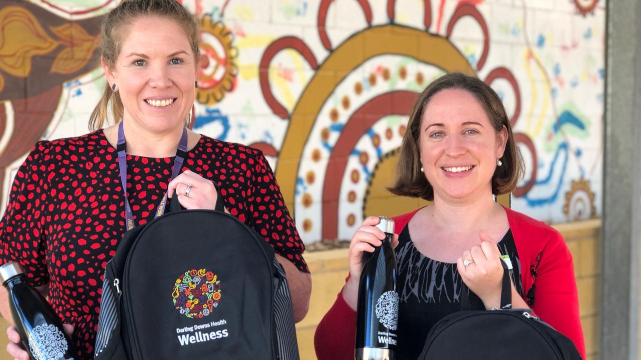 Clinicians Deb Sutton (psychologist) and Roisin Rafferty (dietitian) with the backpacks and water bottles that are given to each Healthy Kids Program participant.