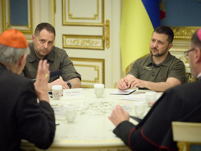 Volodymyr Zelensky listens to Pope Francis' peace envoy to Ukraine, Cardinal Matteo Zuppi, left, during their meeting in Kyiv. Picture: AFP