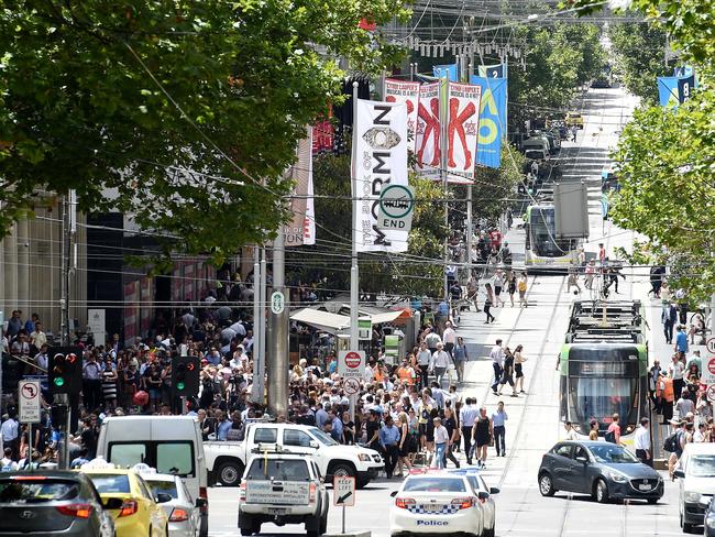 Crowds gather outside Bourke Street Mall to pay tribute to the five victims of Friday’s carnage. Picture: Nicole Garmston