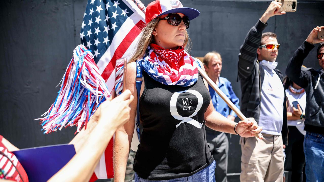 QAnon conspiracy theorists at a rally in May protesting against coronavirus lockdowns. Picture: Sandy Huffaker / AFP