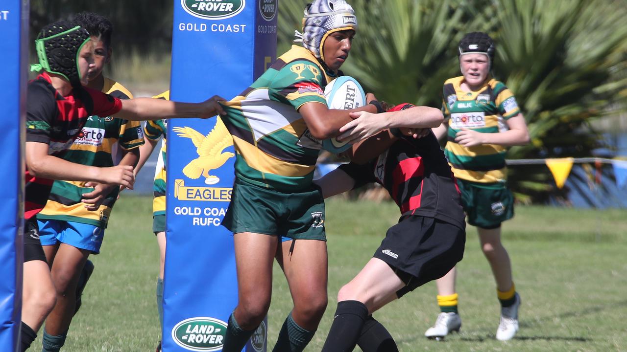 King of the Country U/13 Rugby Union tournament at Overall park Southport. Surfers Paradise(Yellow Green ) V Far North Coast (red black). Picture Glenn Hampson