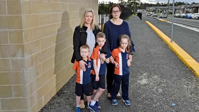 Rebecca Haynes and NKPS P &amp; C chair Alison Nicolson (right) with children Lachlan Haynes, 5, Lukas Haynes, 5, and Charlotte Nicolson, 5, are concerned about the state of the footpath outside the school next to busy Helzett Road. Picture: Troy Snook