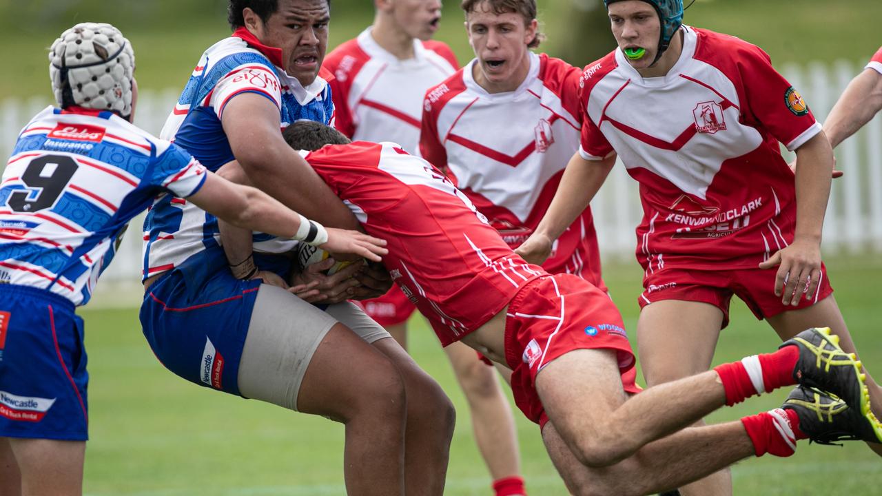 Central north player Jedd Smallwood tackles a much bigger opponent. Picture: Julian Andrews.