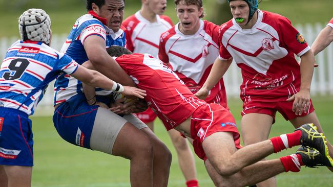 Central north player Jedd Smallwood tackles a much bigger opponent. Picture: Julian Andrews.