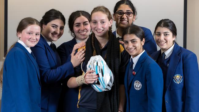 Students from Mercy College Coburg with Erica from Coburg High School. Picture: Mark Dadswell