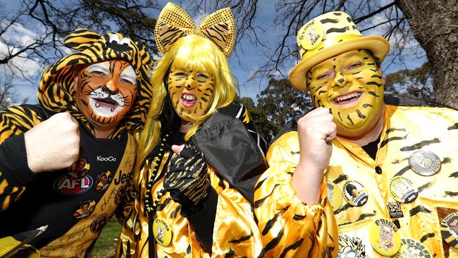 Passionate Tigers fans show their true colours at the final training session at Punt Road Oval. Picture: Robert Cianflone