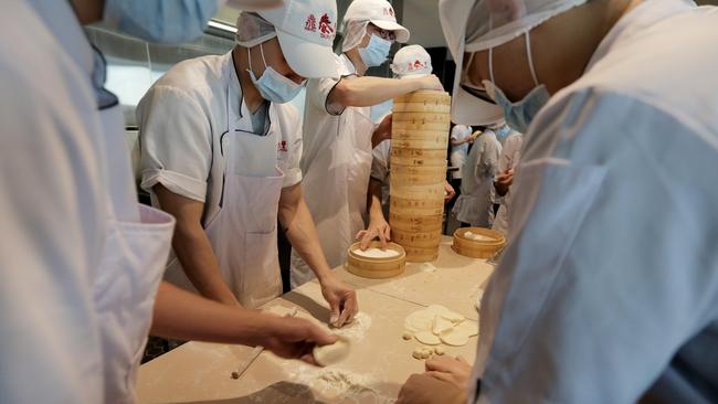 Din Tai Fung: Dumplings being made with measured precision. Picture: Nicole Cleary