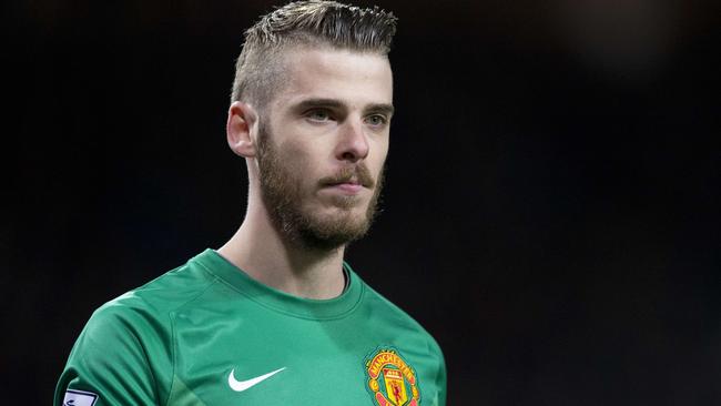 (FILES) In a file picture taken on March 9, 2015 Manchester United's Spanish goalkeeper David de Gea looks on during the FA Cup quarter-final football match between Manchester United and Arsenal at Old Trafford in Manchester, north west England. Spanish goalkeeper David de Gea has signed a new four year contract with Manchester United, keeping him at Old Trafford until at least 2019, less than two weeks after the Spain goalkeeper was on the verge of joining Real Madrid, the club announced on September 11, 2015. AFP PHOTO / OLI SCARFF RESTRICTED TO EDITORIAL USE. No use with unauthorized audio, video, data, fixture lists, club/league logos or “live” services. Online in-match use limited to 45 images, no video emulation. No use in betting, games or single club/league/player publications.