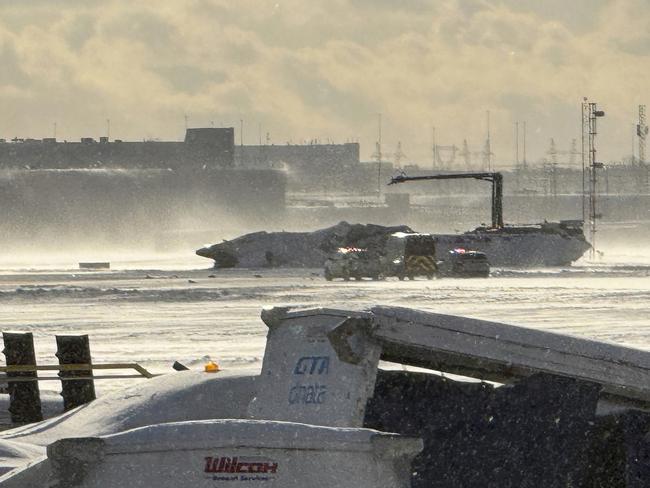 The Delta Air Lines plane overturned after crashing at Toronto’s Pearson Airport. Picture: The Canadian Press via AP