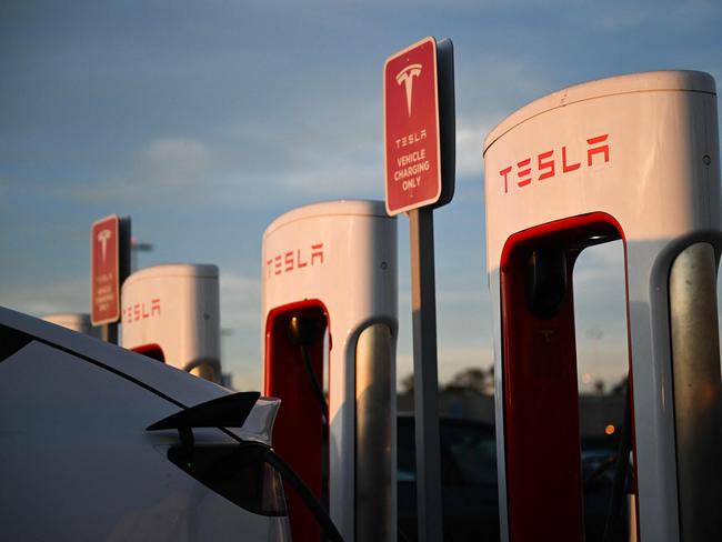 A Tesla, Inc. electric vehicle charges at supercharger location in Hawthorne, California, on August 9, 2022. - Tesla CEO Elon Musk sold 7.92 million shares of Tesla worth around $6.88 billion, according to a series of financial filings published August 9, 2022. His transactions occurred between August 5 and 9, the SEC filings revealed, following Teslaâs 2022 annual shareholder meeting on August 4 in Austin, Texas. Musk tweeted it was important to avoid an emergency sale of Tesla stock amid a legal showdown with Twitter over a $44 billion takeover deal. Earlier this year, the Tesla and SpaceX CEO said on social media that he had âno further TSLA sales plannedâ. (Photo by Patrick T. FALLON / AFP)