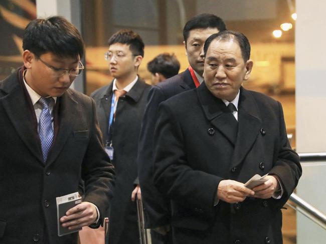 North Korean official Kim Yong Chol, right, prepares to leave the Beijing International Airport in Beijing Thursday, Jan. 17, 2019. Kim arrived in Beijing on Thursday, reportedly en route to the United States for talks ahead of a possible second summit between President Donald Trump and North Korean leader Kim Jong Un. (Kyodo News via AP)