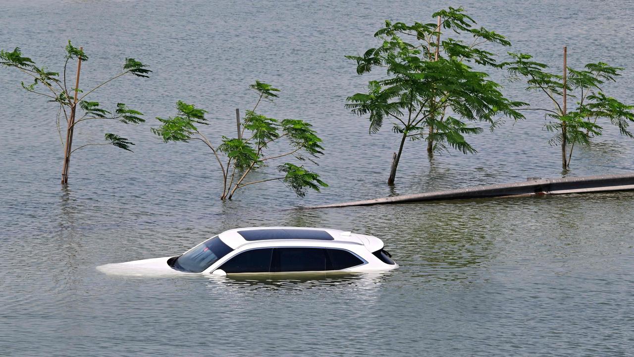 The weather has improved but it will take time to clear Dubai’s waterlogged roads. (Photo by Giuseppe CACACE / AFP)