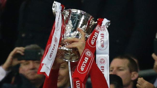 Man of the match, Manchester United's Swedish striker Zlatan Ibrahimovic lifts the trophy as Manchester United players celebrate their victory after the English League Cup final football match between Manchester United and Southampton at Wembley stadium in north London on February 26, 2017. Zlatan Ibrahimovic sealed the first major silverware of Jose Mourinho's Manchester United reign and broke Southampton's hearts as the Swedish star's late goal clinched a dramatic 3-2 victory in Sunday's League Cup final. / AFP PHOTO / Ian KINGTON / RESTRICTED TO EDITORIAL USE. No use with unauthorized audio, video, data, fixture lists, club/league logos or 'live' services. Online in-match use limited to 75 images, no video emulation. No use in betting, games or single club/league/player publications.  /