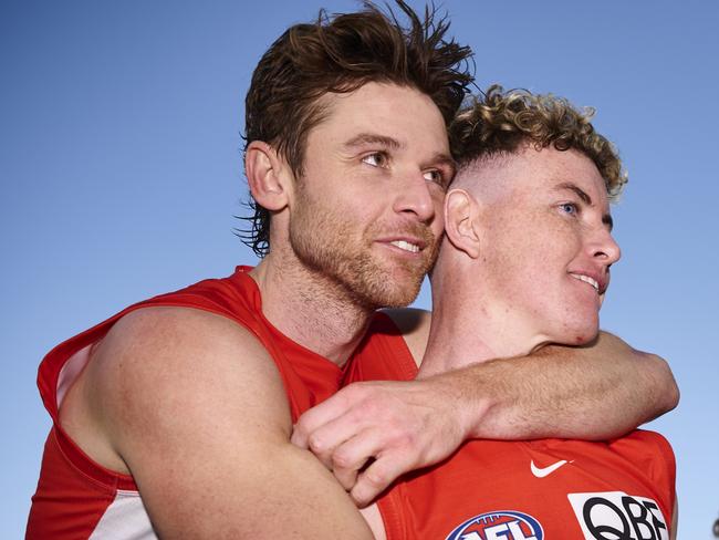 SYDNEY, AUSTRALIA - JULY 30: Dane Rampe of the Swans embraces Chad Warner of the Swans after victory during the round 20 AFL match between the Sydney Swans and the Greater Western Sydney Giants at Sydney Cricket Ground on July 30, 2022 in Sydney, Australia. (Photo by Brett Hemmings/AFL Photos/via Getty Images )