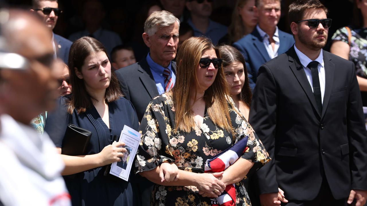 Grieving family watch on as the coffin of firefighter Michael Kidd arrives at the church. Picture: NCA NewsWire / Damian Shaw