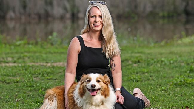 Cassandra Kirkland with 7 year old border collie, Zoe who was treated at the vet for ticks after walking along the river in Fig Tree Pocket.  Picture: Zak Simmonds