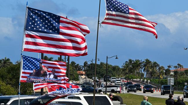 Supporters of US President-elect Donald Trump cheer as his motorcade departs from his residence Mar-a-Lago Club in Palm Beach, Florida. Picture; AFP.