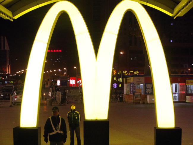 In this photo taken Saturday, May 21, 2011, a giant logo of fast food restaurant McDonald's is displayed at a train station in Shenyang in northern China's Liaoning province. McDonald’s and KFC in China faced a new food safety scare Monday, July 21, 2014 after a Shanghai television station reported a supplier sold them expired beef and chicken. (AP Photo/Ng Han Guan)