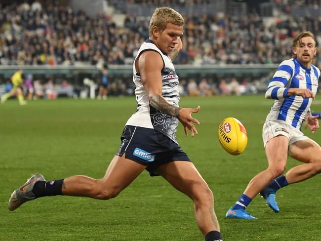 Quinton Narkle kicks long. Picture: Morgan Hancock/Getty Images