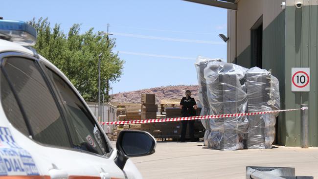 Northern Territory police at the Harvey Norman warehouse on Smith St, Alice Springs, on Tuesday February 4. Picture: Gera Kazakov