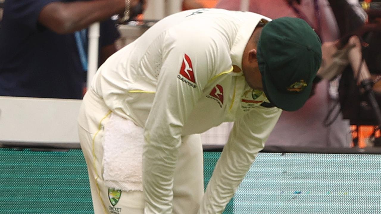 Usman Khawaja is injured attempting to take a catch on day four. Picture: Getty Images