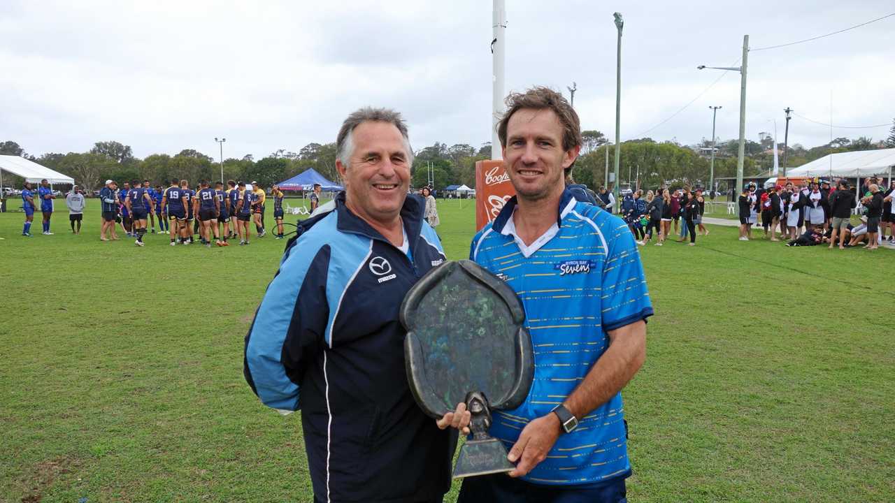 Ian Hooper known as 'Hoops' at the annual Byron 7's Rugby Carnival, presenting 'The Monkey' Trophy to Referee Matt Clayton. Picture: William Palmer