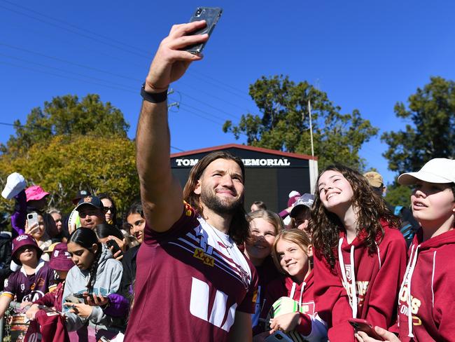 Carrigan interacts with fans during a Queensland Maroons State of Origin training session. Picture: Albert Perez/Getty Images