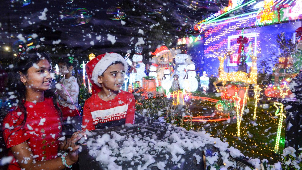 Haasini Allada, 11, and Aryan Hingvasiya, 8, enjoy Christmas lights on Golding Street, Beverley. Picture: Brenton Edwards