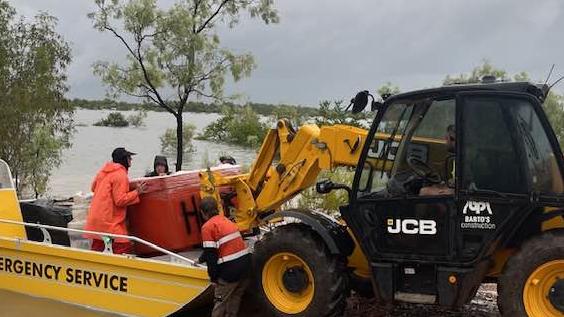 Members of the State Emergency Services in Normanton and Karumba using flood boats have been integral to ensuring food supplies are distributed to remote towns and communities isolated by the longer-than-usual west season. Picture: Supplied