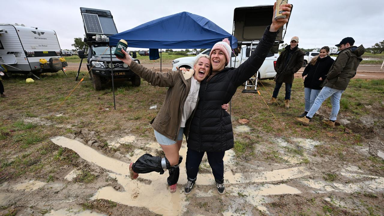 Revellers were forced to get ready for the races in muddy conditions. Picture: Lyndon Mechielsen/MaxAgency