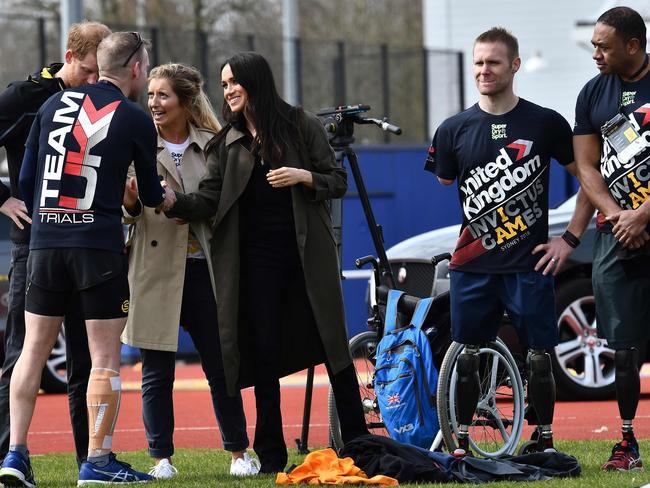 Britain's Prince Harry and his fiancee Meghan Markle accompanied by Invictus Games UK Team Chef de Mission Jayne Kavanagh meet participants at the UK team trials for the Invictus Games Sydney 2018. Picture: AFP