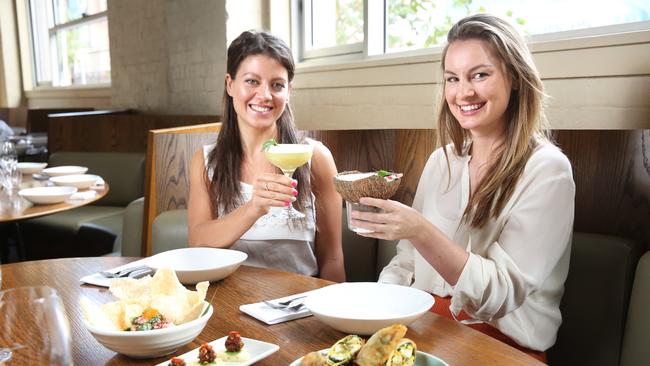 Hazel Nihad and Miranda Walker try out the food and matching cocktail menu at Longrain restaurant in Surry Huills. Picture: Bob Barker