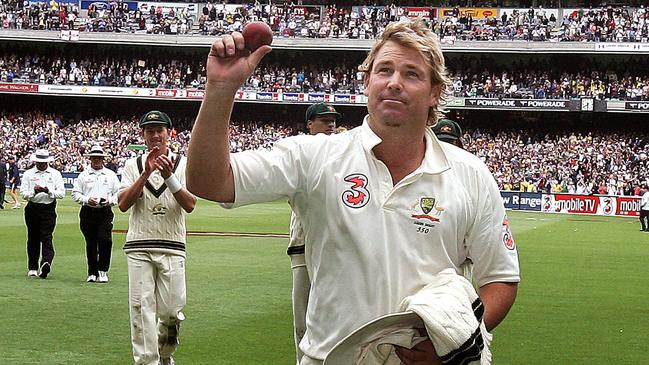 Shane Warne holds the Kookaburra aloft to celebrate taking five wickets against England in the 2006 Boxing Day Test at the MCG.