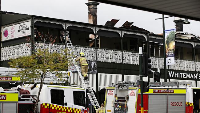 Firefighters on the scene on Friday morning. Picture: Adam Yip