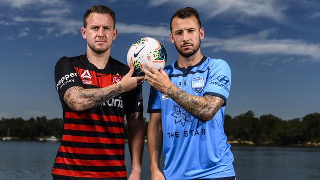 Simon Cox (left) will go head-to-head with Sydney FC striker Adam Le Fondre in Saturday’s derby. Picture: Darren Leigh Roberts