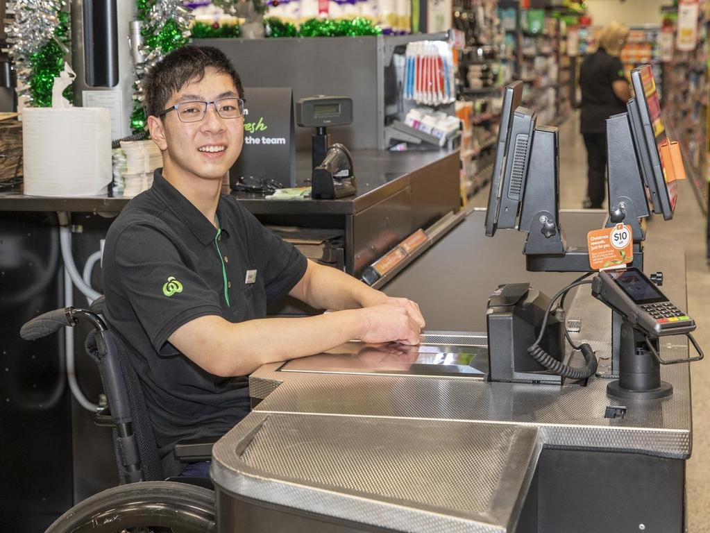 Johnson Chen, 19, working at Woolies’ new accessible checkout. Picture: Dallas Kilponen/Woolworths