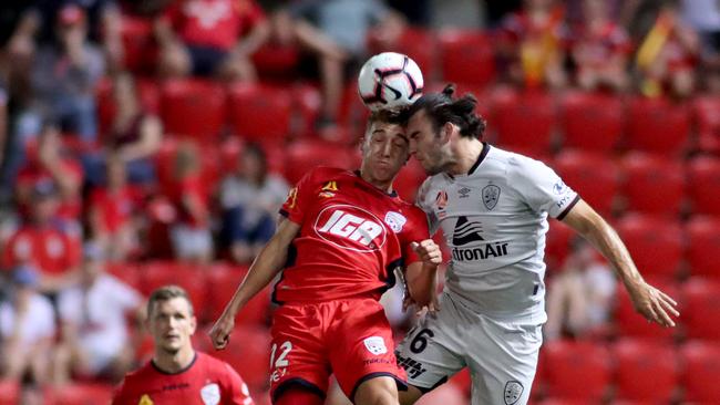 Adelaide United’s Carlo Armiento and Brisbane Roar’s Nicholas D'Agostino during the round 17 A-League clash at Coopers Stadium in February. (AAP Image/Kelly Barnes)