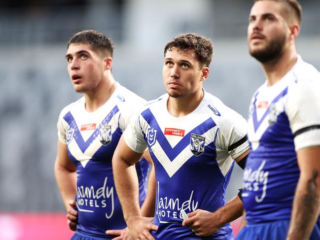 SYDNEY, AUSTRALIA - JULY 03: Jake Averillo (C) of the Bulldogs looks dejected after a try during the round 16 NRL match between the Canterbury Bulldogs and the Manly Sea Eagles at Stadium Australia, on July 03, 2021, in Sydney, Australia. (Photo by Mark Kolbe/Getty Images)