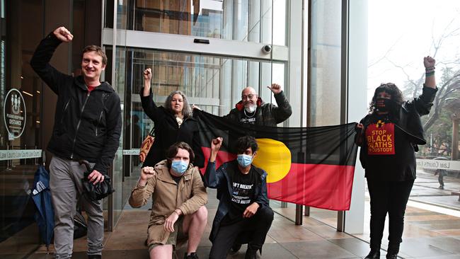 Black Lives Matter protest organisers pose for a photo out the front of The Supreme Court in Sydney. Picture: Adam Yip