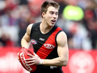 MELBOURNE, AUSTRALIA - AUGUST 05: Zach Merrett of the Bombers runs with the ball during the round 20 AFL match between the Essendon Bombers and the Carlton Blues at Melbourne Cricket Ground on August 5, 2017 in Melbourne, Australia.  (Photo by Robert Cianflone/Getty Images)