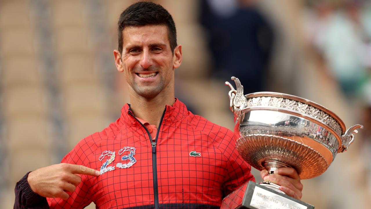 Novak Djokovic with his No. 23 jacket. Photo by Clive Brunskill/Getty Images.