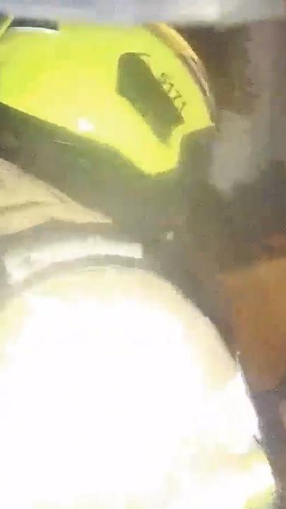 Dramatic moment cop rushes into burning house to save woman from arson attack