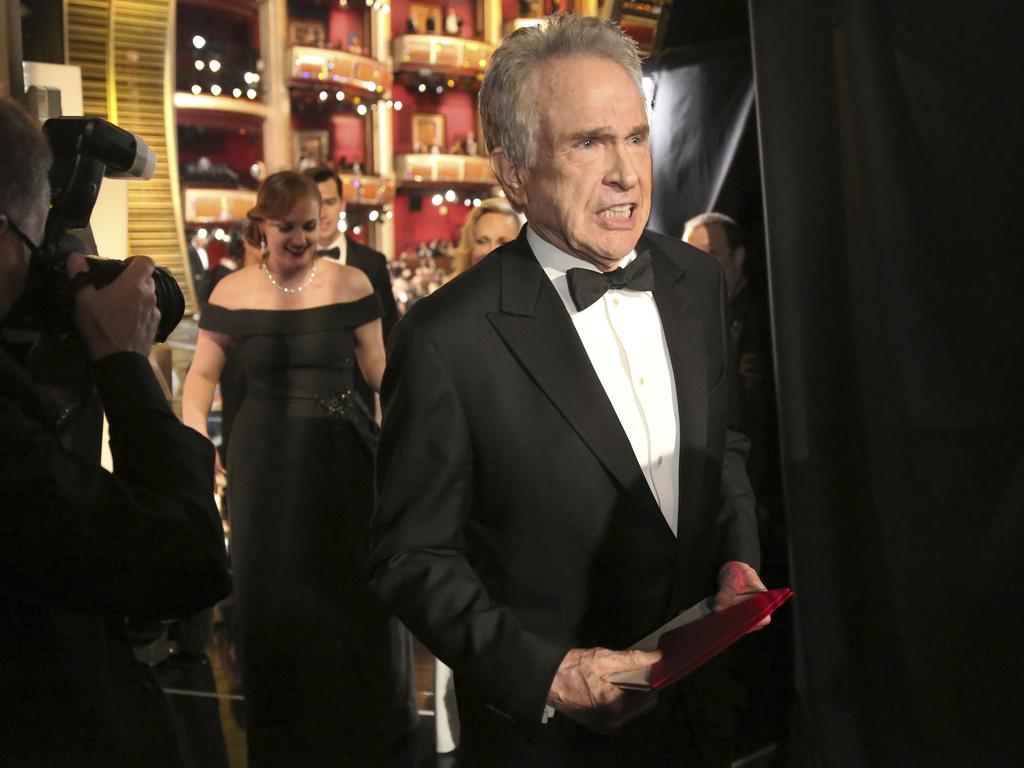 Warren Beatty exits the stage after announcing the award for “Best Picture” during the 89th Annual Academy Awards. Picture: AFP