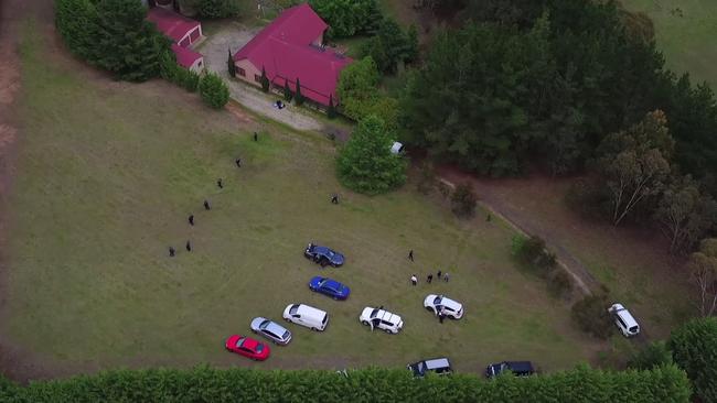 Police vehicles at the bush property. Picture: NSW Police