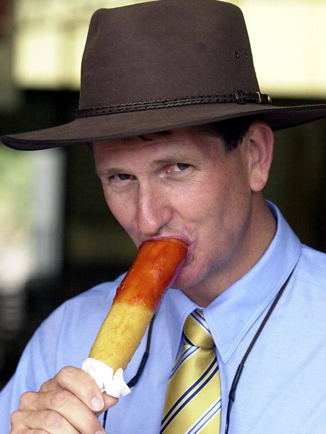 Then opposition leader Lawrence Springborg eats a Dagwood dog at the Stanthorpe Show during the 2004 state election campaign. Picture: David Sproule