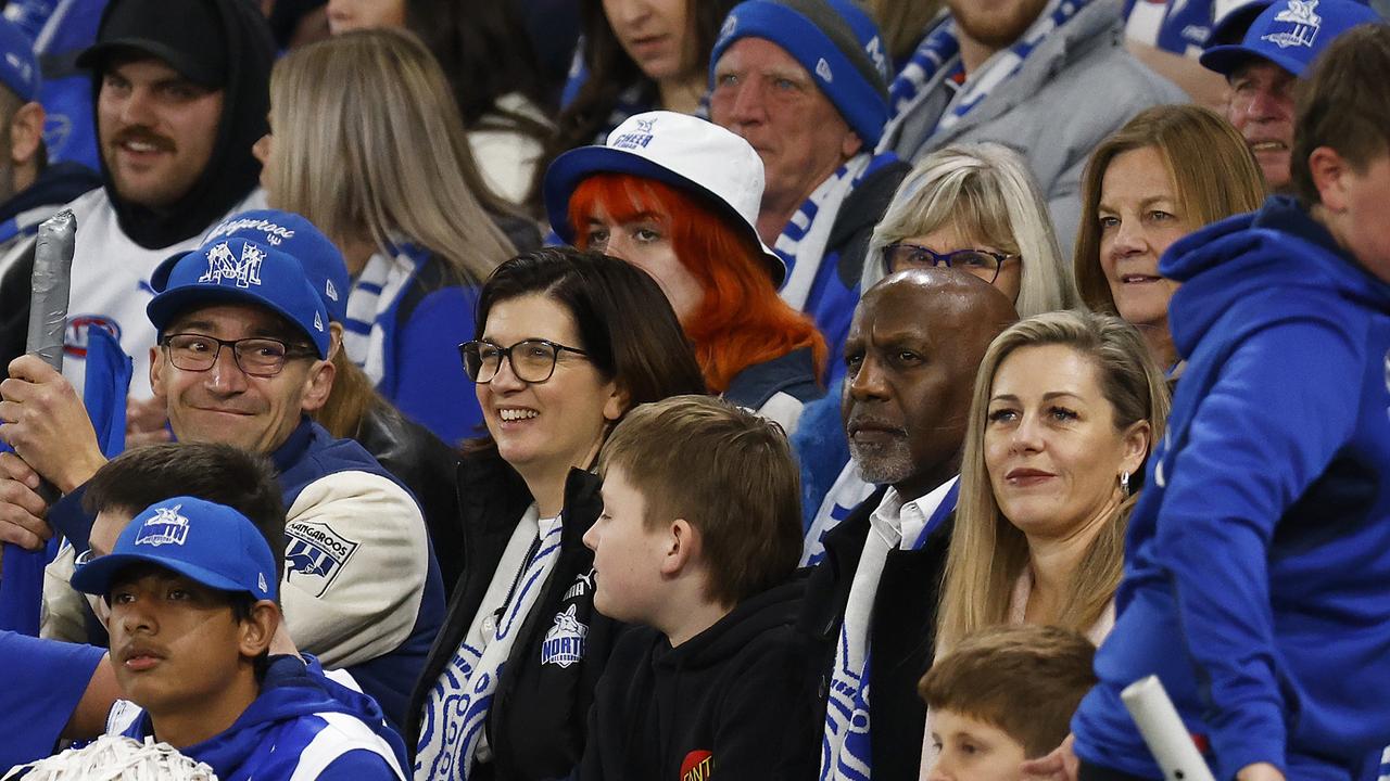 Kangaroos president Sonja Hood and CEO Ben Amarfio sit in the Kangaroos cheer squad. Picture: Daniel Pockett/Getty Images