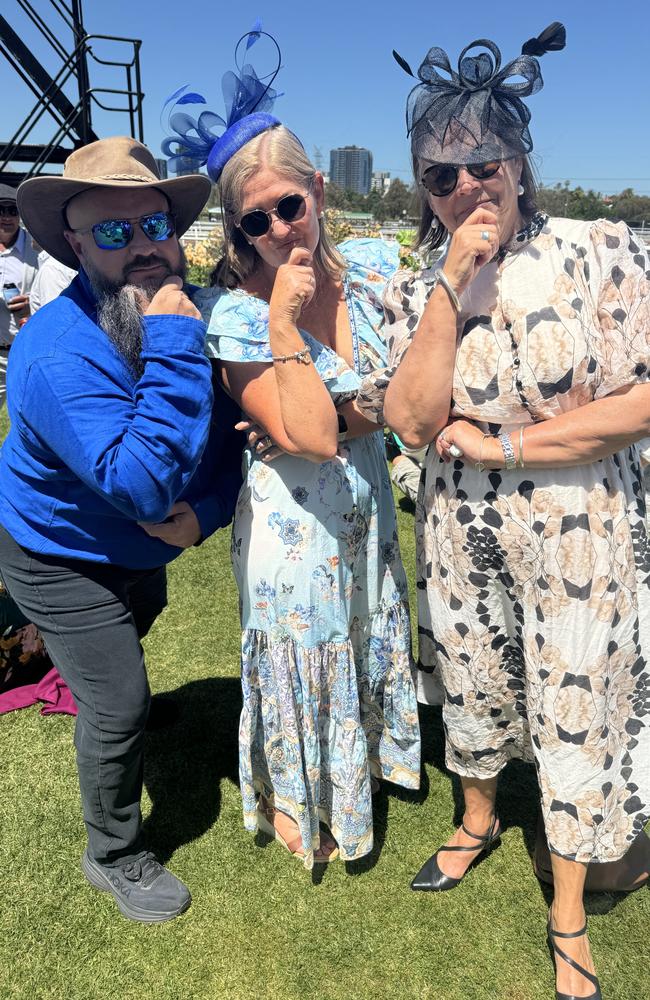 Ryan Campbell, Danielle Campbell and Penny Shields do the "Raygun" at the Melbourne Cup at Flemington Racecourse on November 5, 2024. Picture: Phillippa Butt