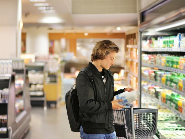 man choosing a dairy products at supermarket Picture: Istock