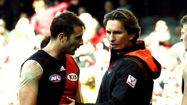 James Hird chats to Jobe Watson during his stint as coach.