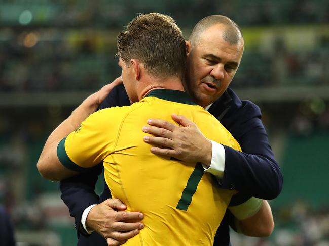 Cheika and Michael Hooper embrace after the Wallabies’ loss to England in Japan.